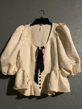 Cream Textured Peplum Blouse with Bow Tie